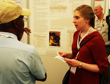 Travel award recipient Courtney Holdt, North Dakota State University, presents her poster. Photo credit Juan Osorno.